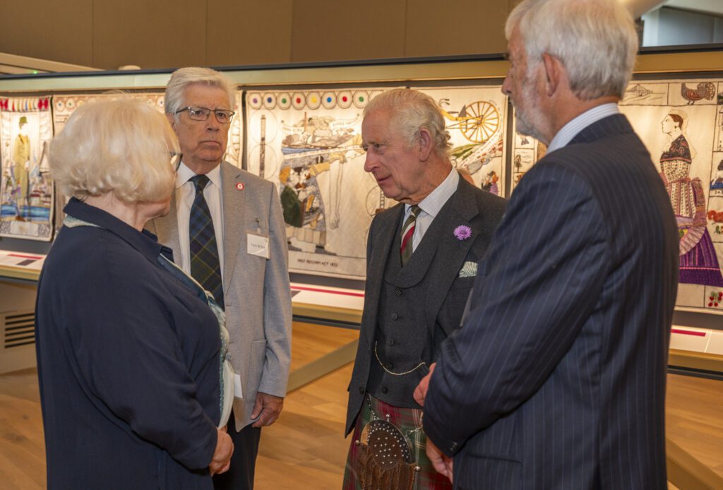 Dorie Wilkie, Head Stitcher, and Tom Wilkie greet King Charles III