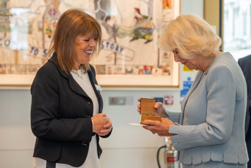 Her Majesty is presented with a Stitchers Pin in a specially designed box by Sandy Maxwell-Forbes